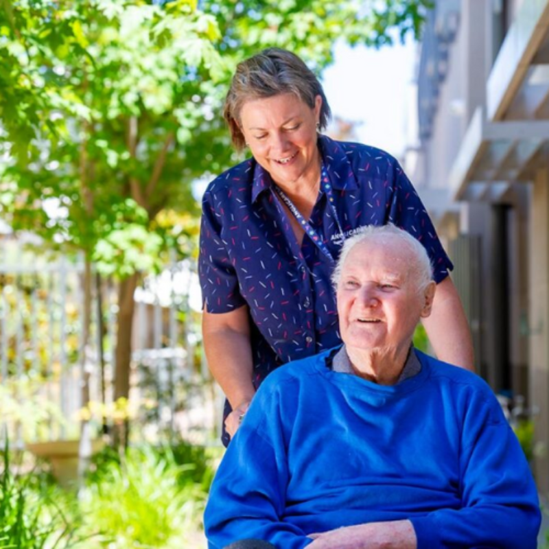 Anglicare SA worker in uniform with resident