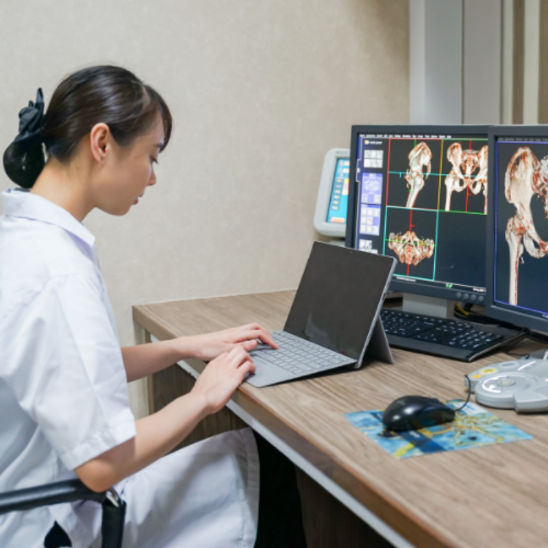 Clinician reviewing diagnostic information at computers