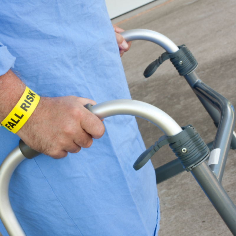 Close up of seniors hands using walking frame