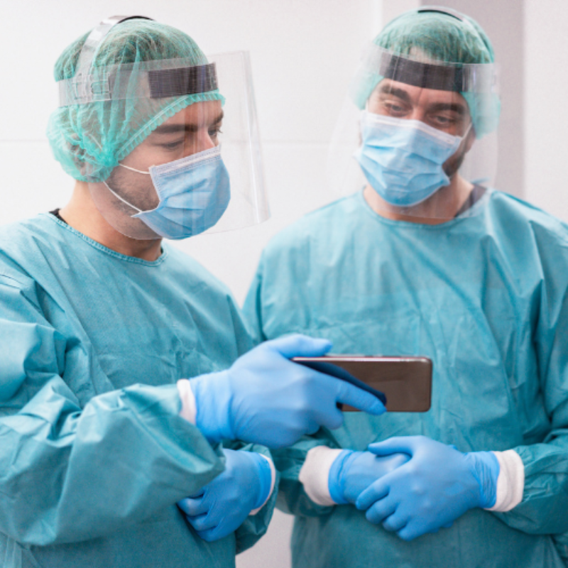 Surgeons examining a mobile phone