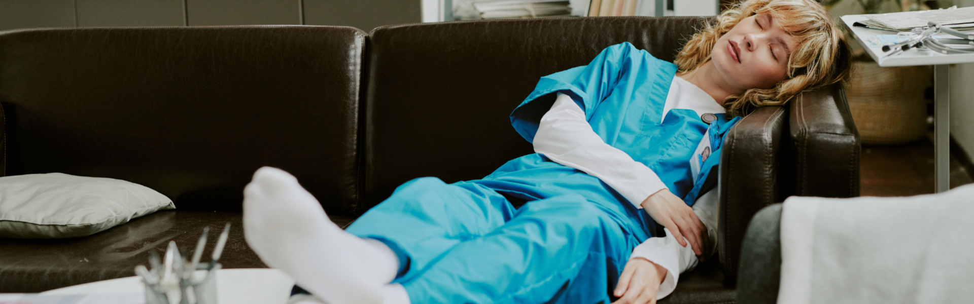 Doctor asleep on couch in break room