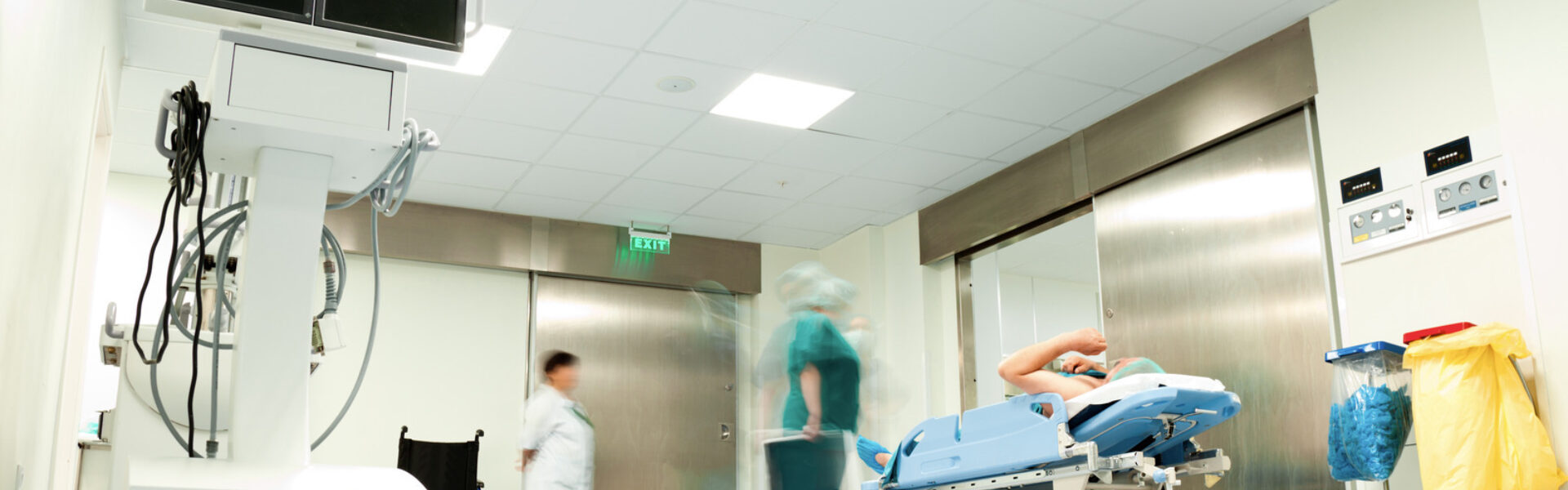 Hospital corridor with patient on gurney