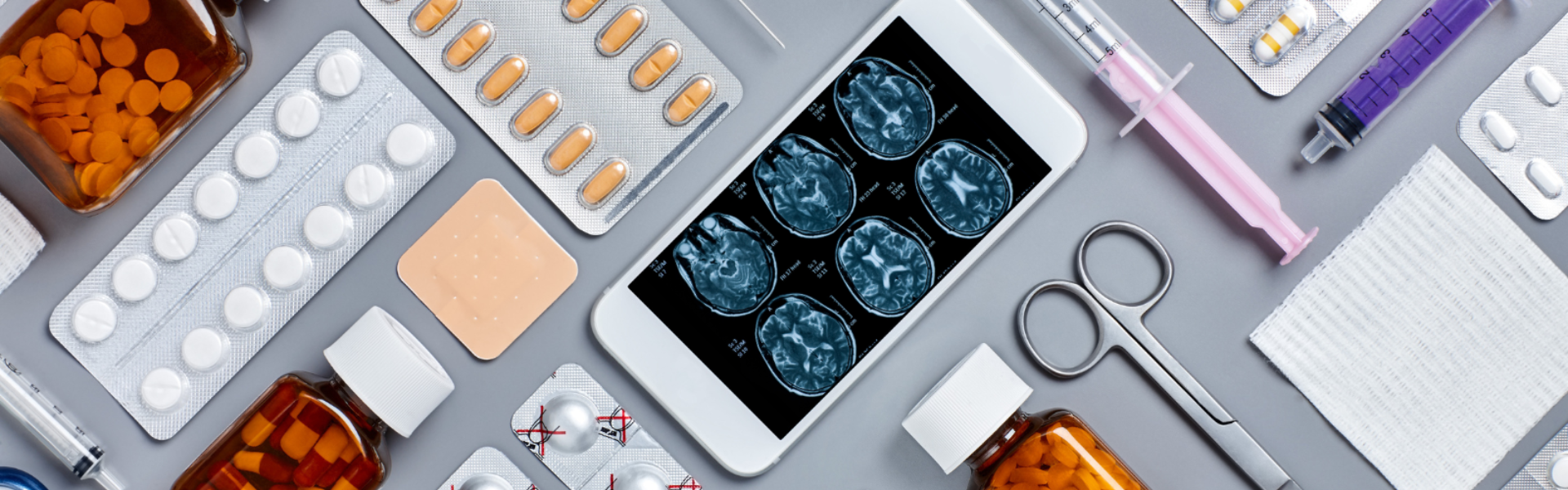 Phone with MRI report and various medical paraphernalia