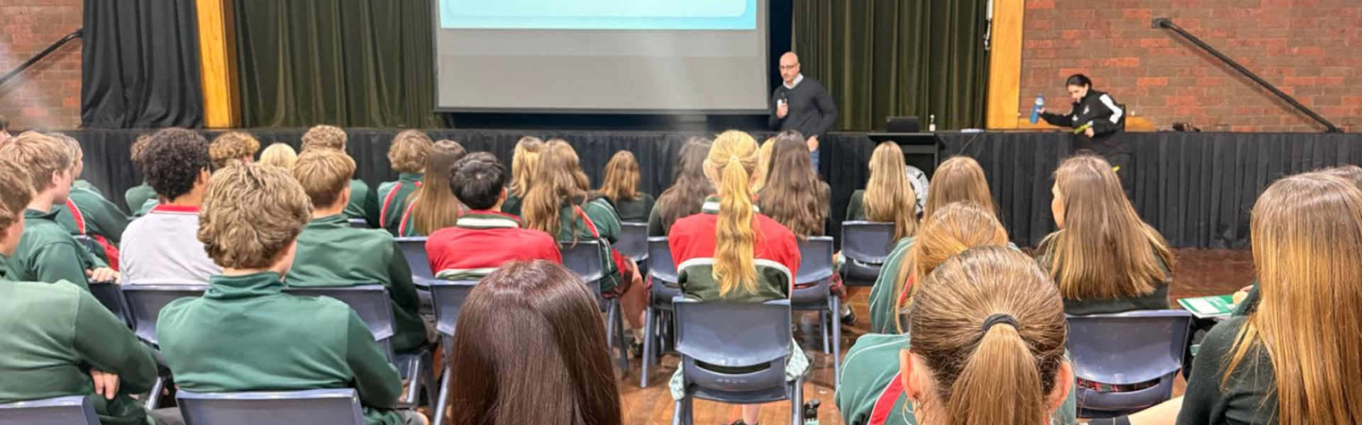 Reza Forozandeh speaking to high school students forward