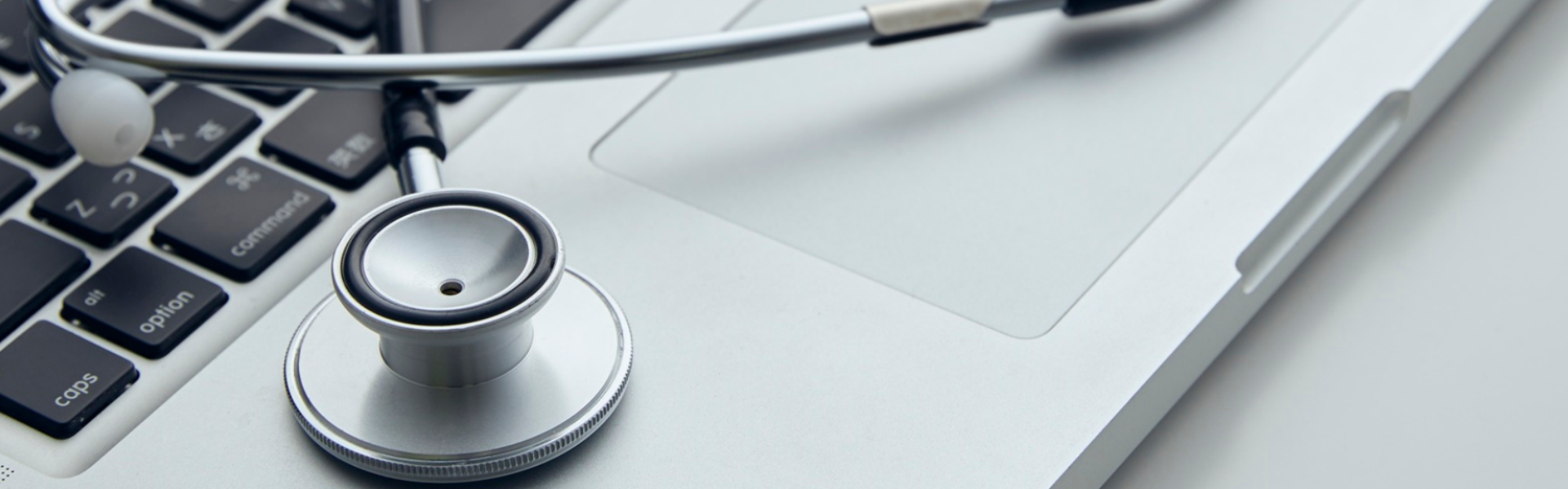 Stethoscope on Mac Book computer