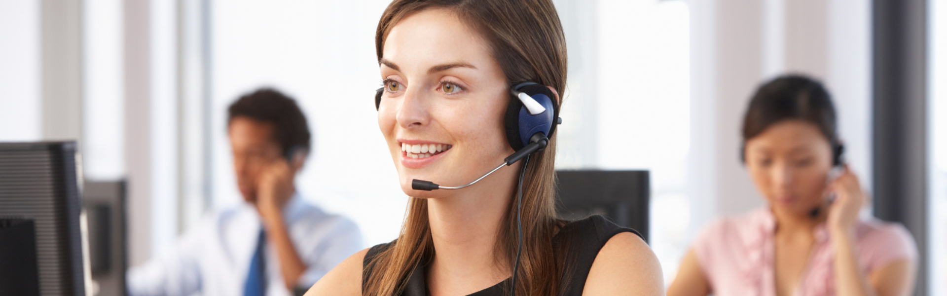 Woman with headset in call centre